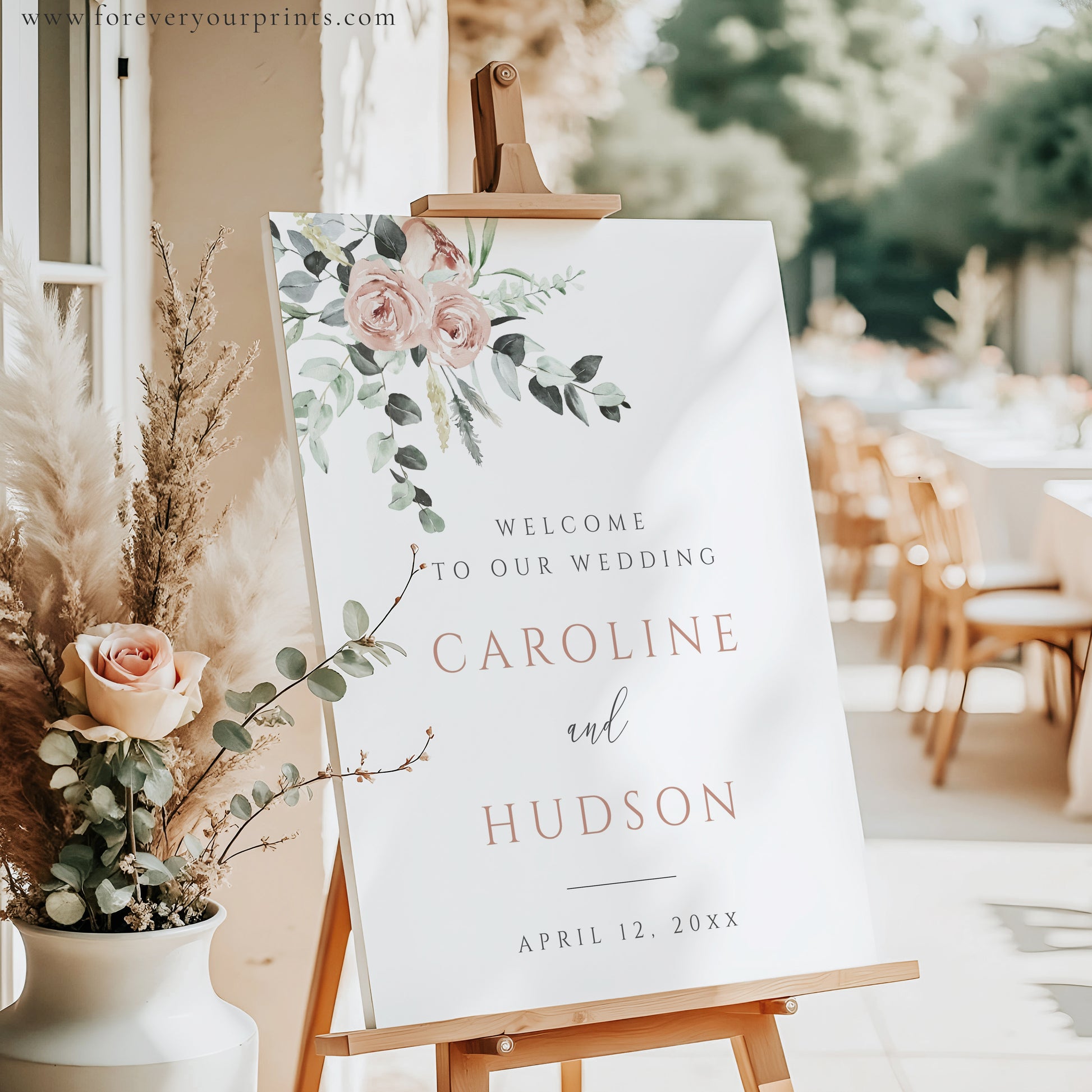 Blush floral and eucalyptus greenery wedding welcome sign template with rose gold spaced lettering on cream background, editable in Canva
