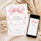 Editable pink bow baby shower invitation Canva template with oversized watercolour blush bow and flowing ribbon tails, bold spaced serif typography, and italic script on a soft blush background