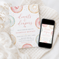 Editable donuts and diapers baby shower invitation Canva template with watercolour pastel donuts, rainbow sprinkles, and script typography on a white background