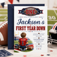 First Year Down first birthday invitation with little football player, stadium field, helmet, football, and red navy sports birthday party details