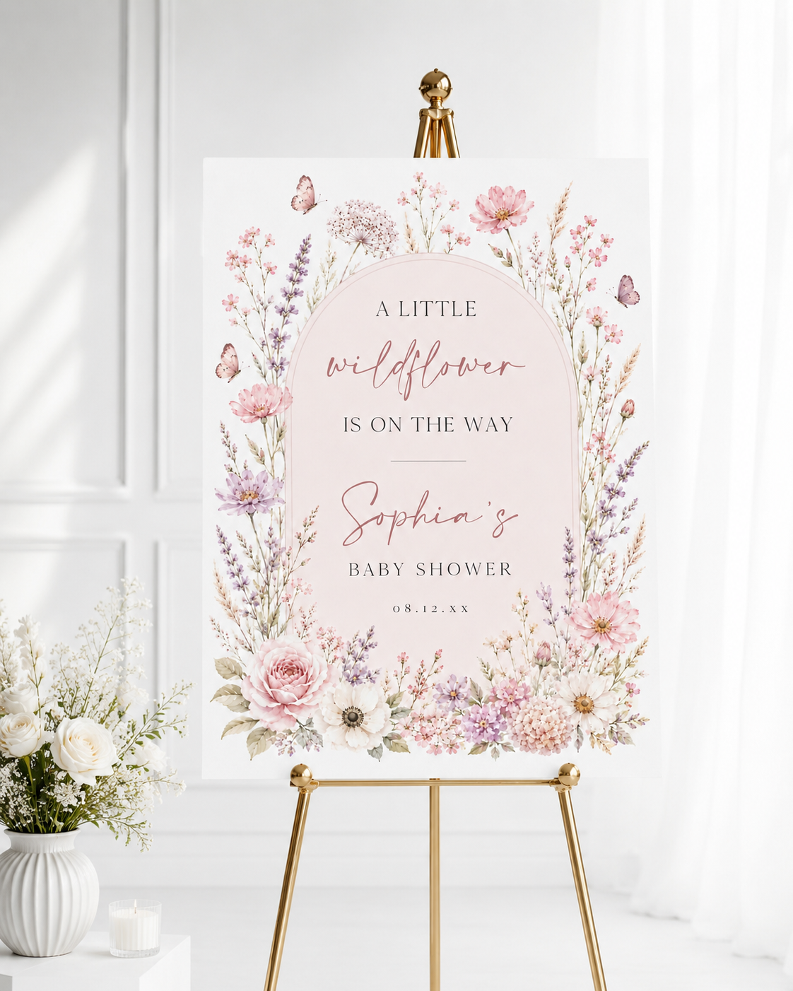 Editable wildflower baby shower welcome sign Canva template with watercolour roses, lavender, cosmos, blush arch, and butterfly details in soft pink and purple tones
