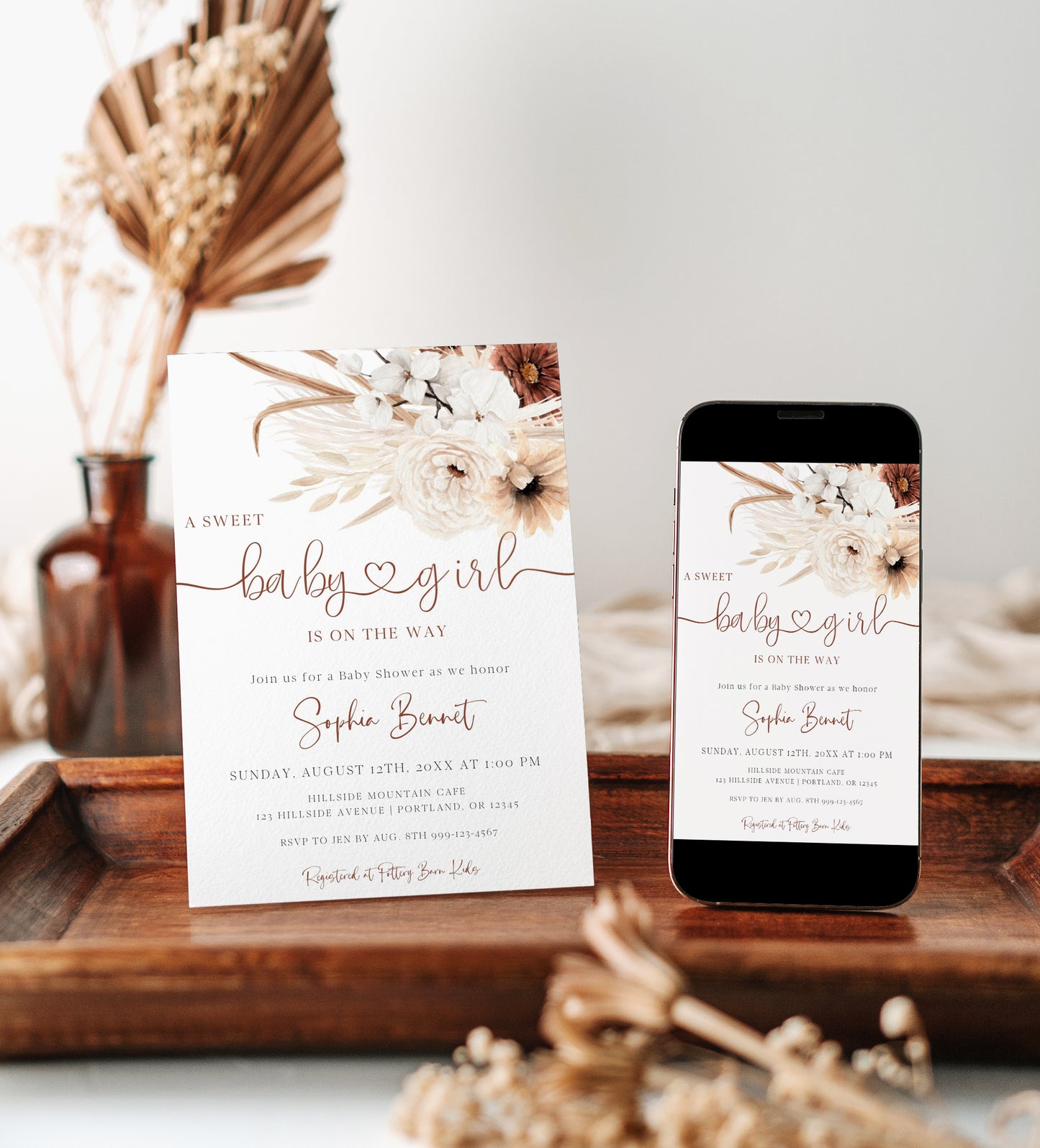 Boho brown floral baby girl shower invitation template with pampas grass, white orchids, and terracotta florals with rust calligraphy script, editable in Canva