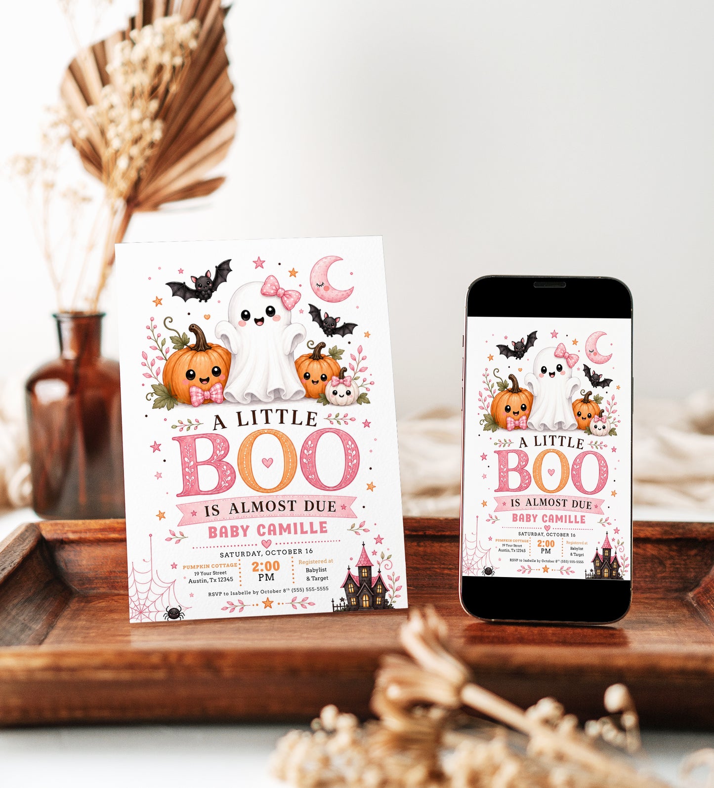 Halloween baby shower invitation with cute ghost, pink bow, smiling pumpkins, bats, pink crescent moon, spiderweb, haunted house, and spooky-cute baby shower details