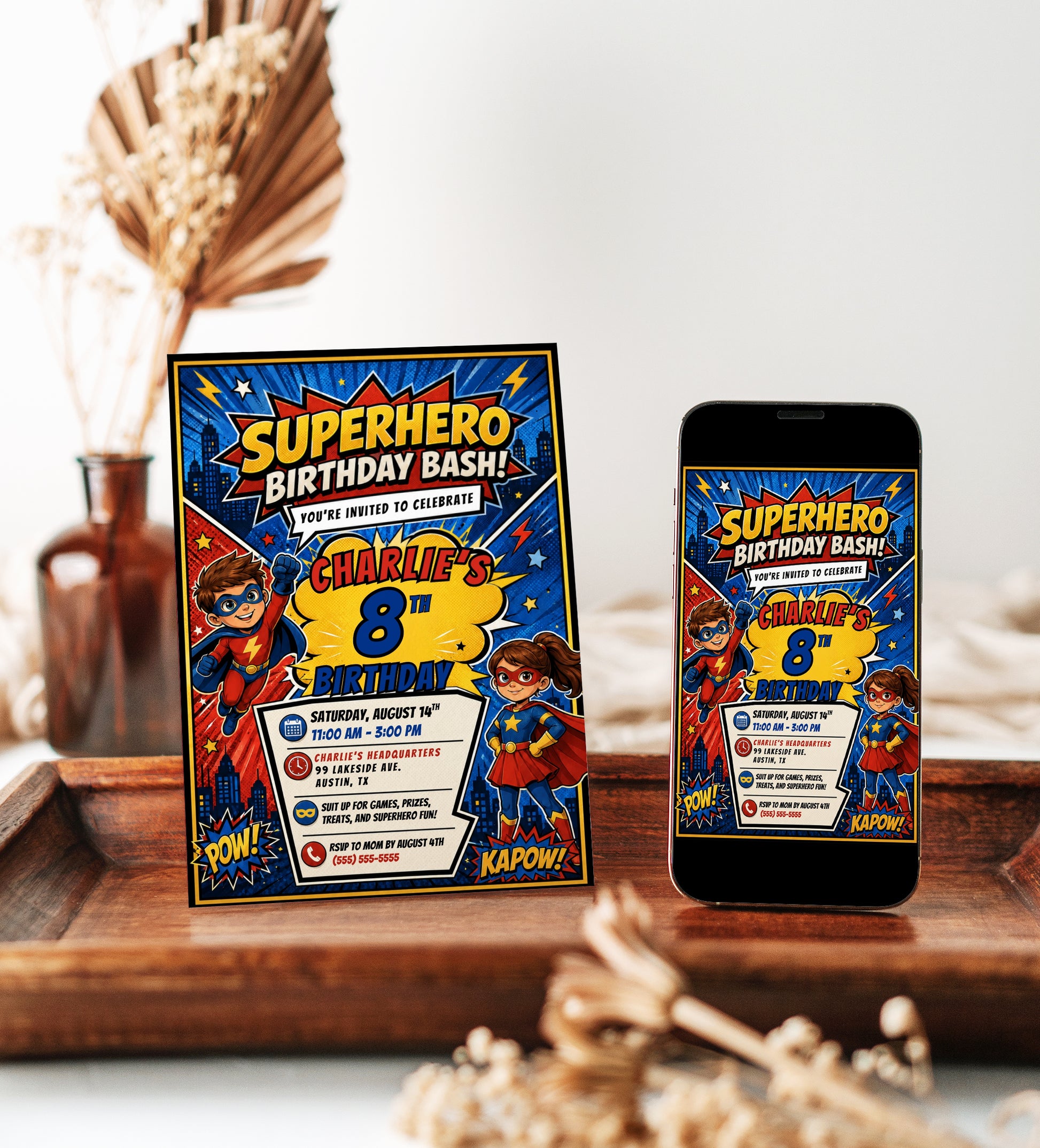 Superhero birthday invitation featuring comic book style boy and girl heroes, city skyline, POW and KAPOW graphics, stars and lightning bolts.
