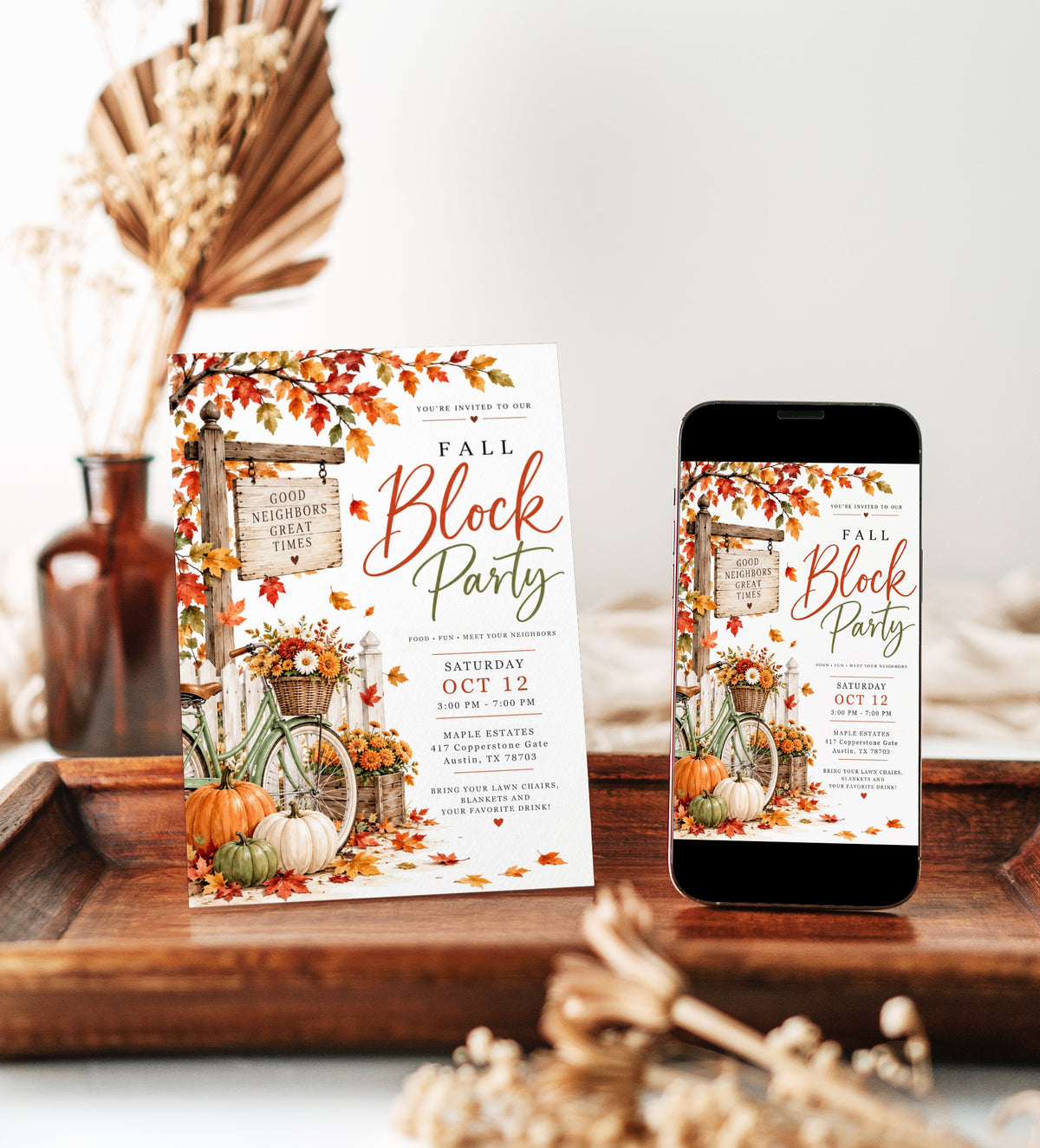 Fall block party invitation with orange autumn leaves, pumpkins, a green bicycle with a flower basket, white picket fence, and rustic Good Neighbors Great Times sign