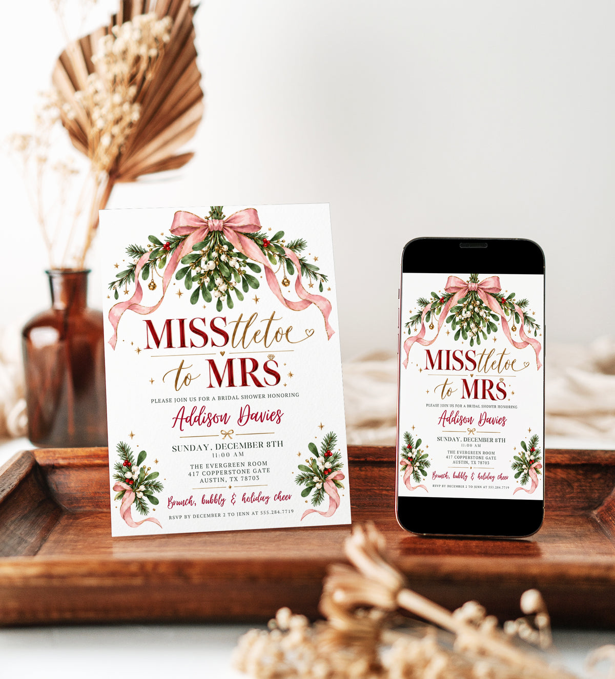 Christmas bridal shower invitation with pink satin bows, mistletoe, evergreen branches, gold bells and MISStletoe to Mrs lettering