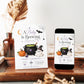 A Baby Is Brewing baby shower invitation with bubbling cauldron, pumpkin, potion bottle, ghost in witch hat, bat, crescent moon, and Halloween baby shower details