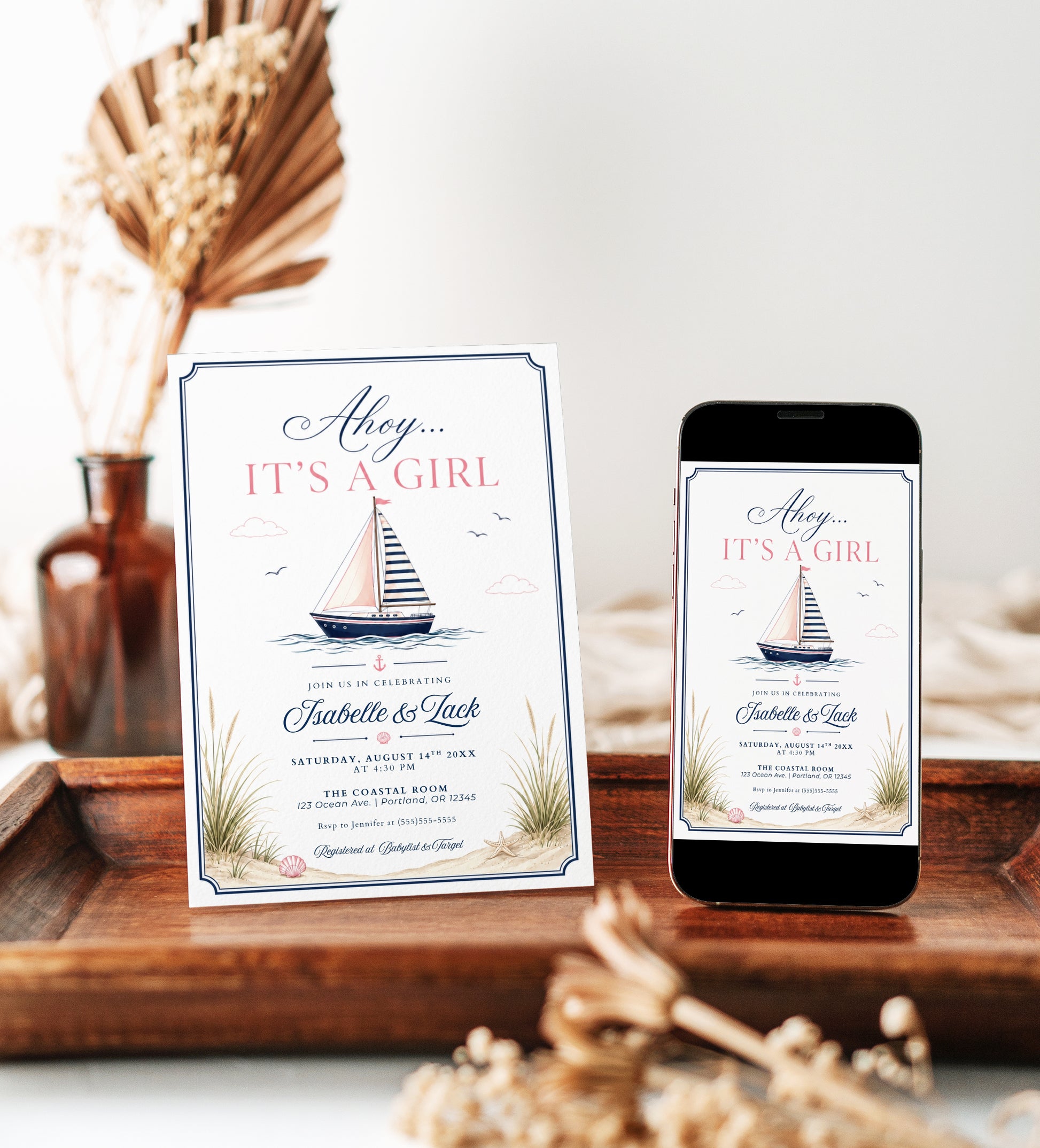 Nautical girl baby shower invitation with a sailboat, seashells, and beach grass in navy and blush pink