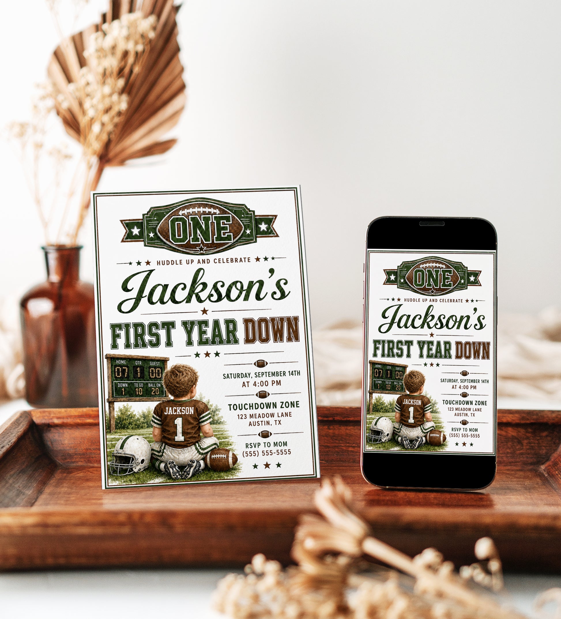 First Year Down first birthday invitation with little football player, scoreboard, helmet, football, and green brown football party details
