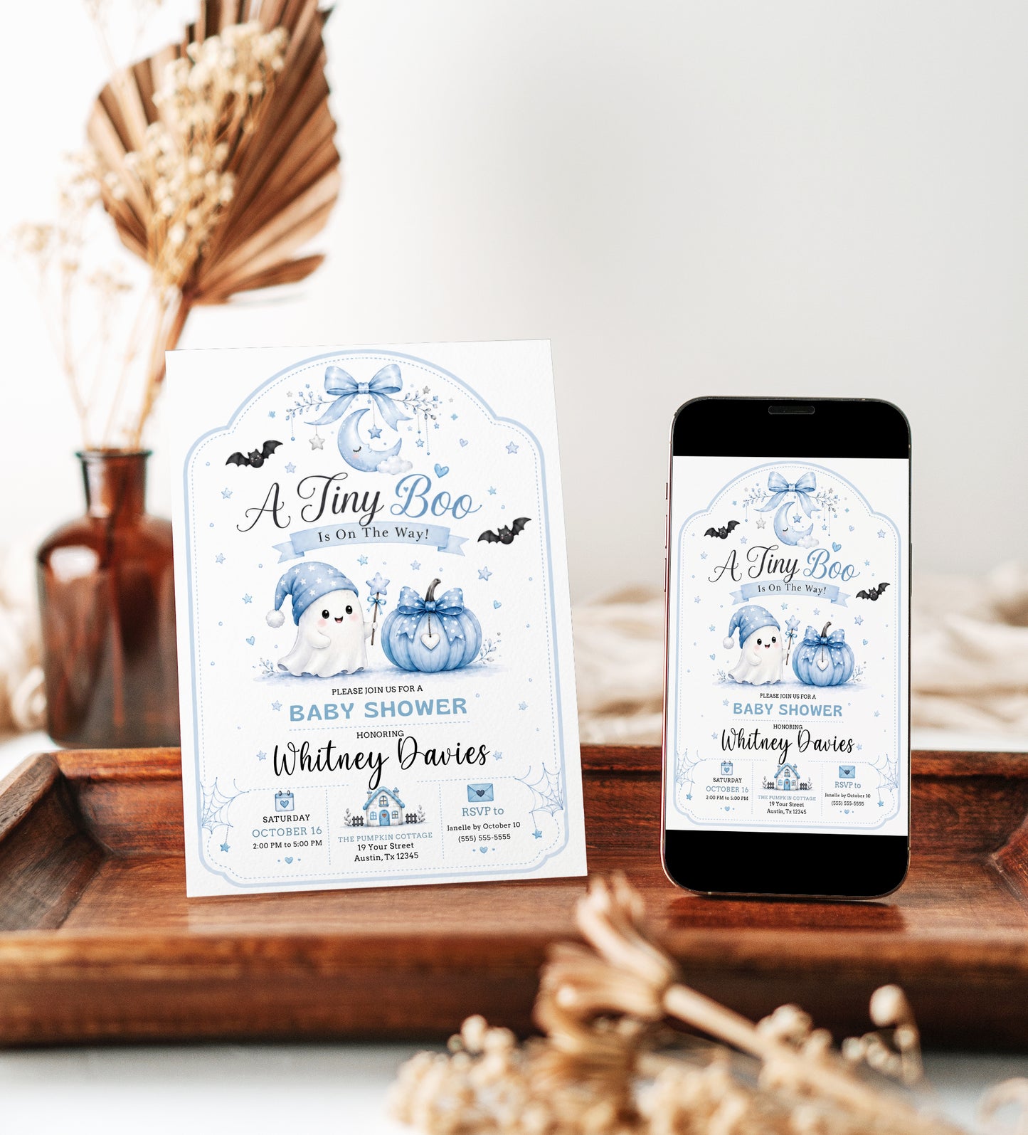 Tiny boo baby shower invitation with cute ghost, blue pumpkin, bats, crescent moon, stars, spiderweb accents, bow details, and soft Halloween baby boy design