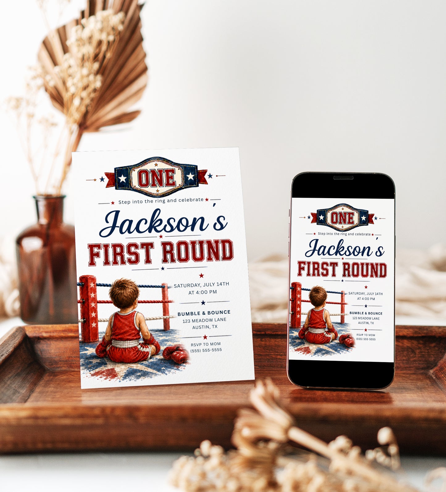 First Round first birthday invitation with championship belt, boxing ring ropes, red and blue stars, and little boxer artwork for a boxing birthday party