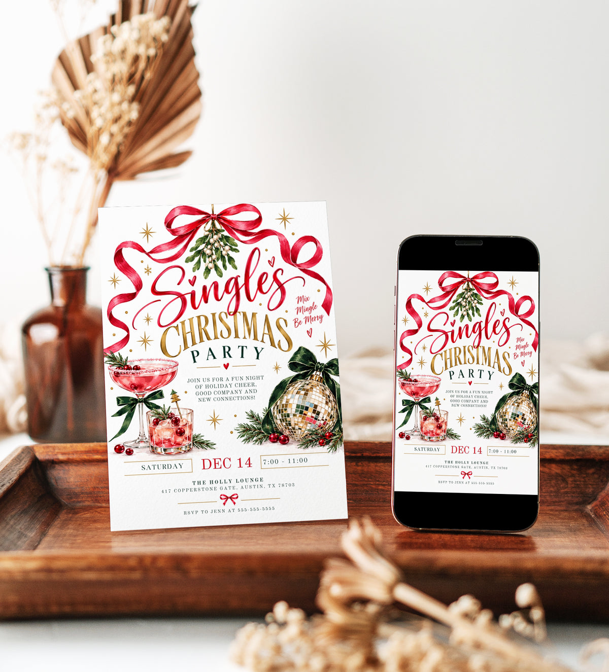 Singles Christmas party invitation with pink holiday cocktails, a gold disco ball ornament, hanging mistletoe, flowing red ribbon, green bows, and gold stars