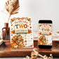 Fall 2nd birthday invitation with Our Little Turkey Is Turning Two wording, a cute turkey, orange gingham bow, pumpkins, and autumn leaves