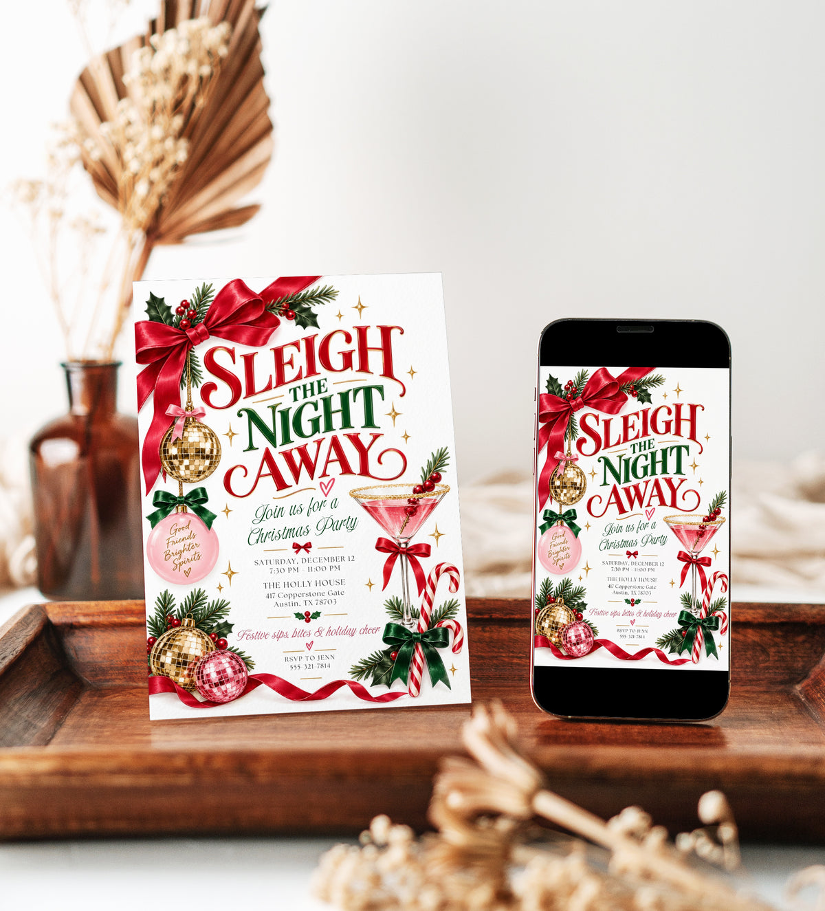 Christmas cocktail party invitation with Sleigh the Night Away lettering, a pink martini, gold and pink disco balls, ribbon bows, and evergreen sprigs