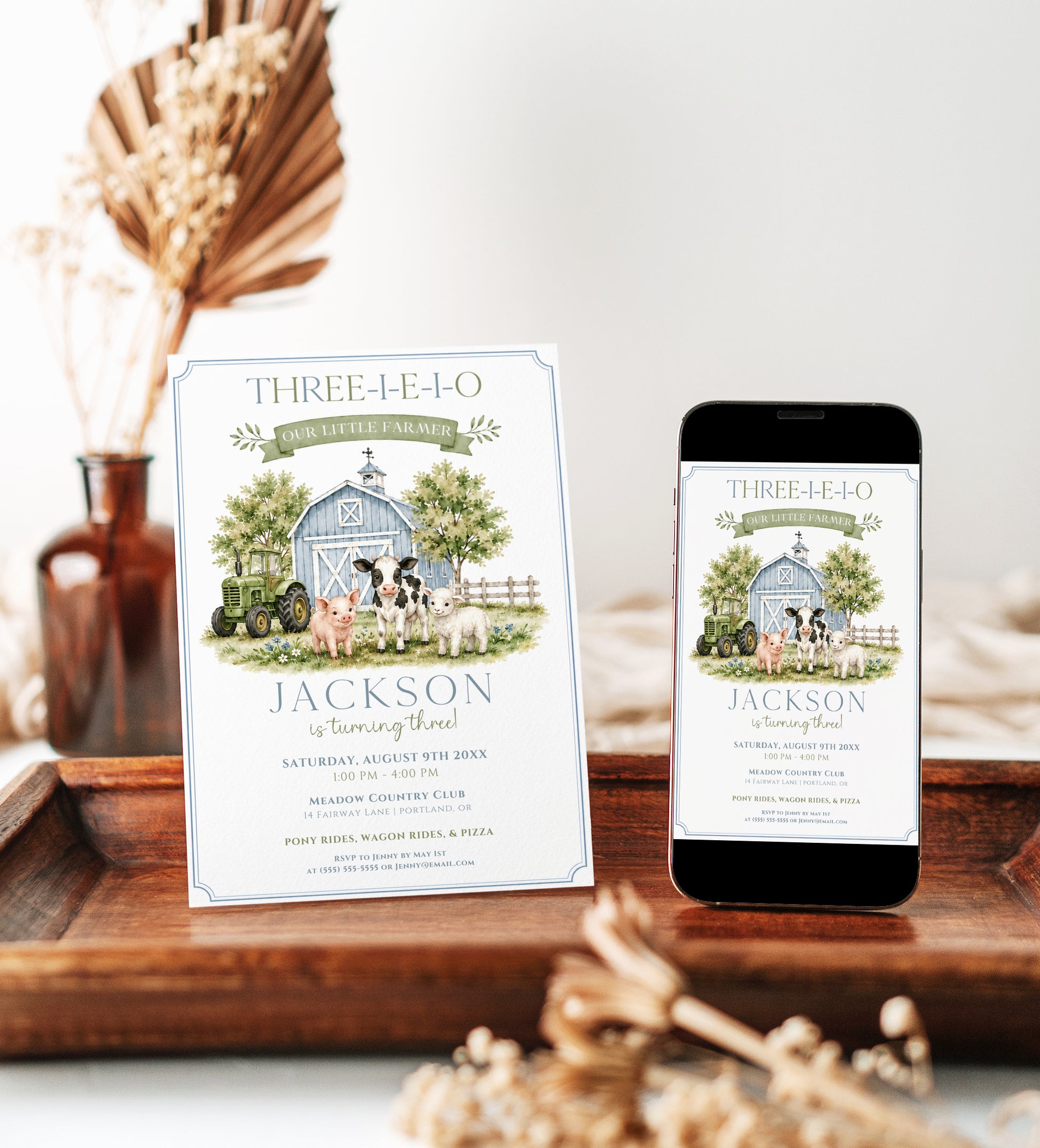 Our little farmer birthday invitation with a blue barn, green tractor, cow, pig, and lamb in soft blue and green