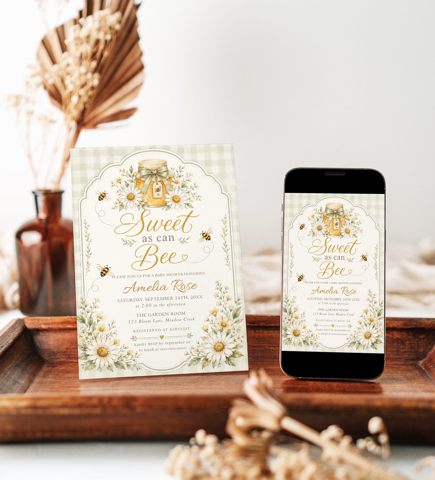 Editable sage green sweet as can bee baby shower invitation Canva template with watercolour honey jar, white daisies, bumble bees, and gold script typography on a sage gingham background