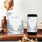 Winter baby shower invitation with blue snowflakes, snow-covered evergreen trees, frosted foliage, and A Little Snowflake Is on the Way wording on white