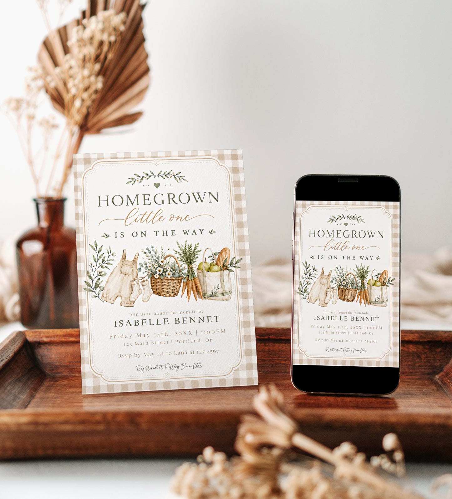 Editable homegrown baby shower invitation Canva template with watercolour baby overalls, daisy basket, carrots, market tote, gingham background, and olive branch accents