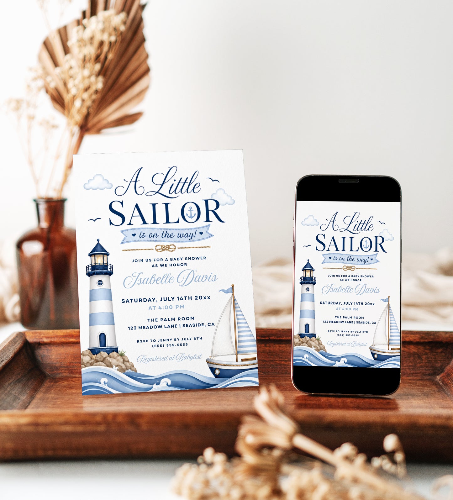 Little sailor nautical baby shower invitation with a lighthouse, sailboat, and ocean waves in navy and light blue