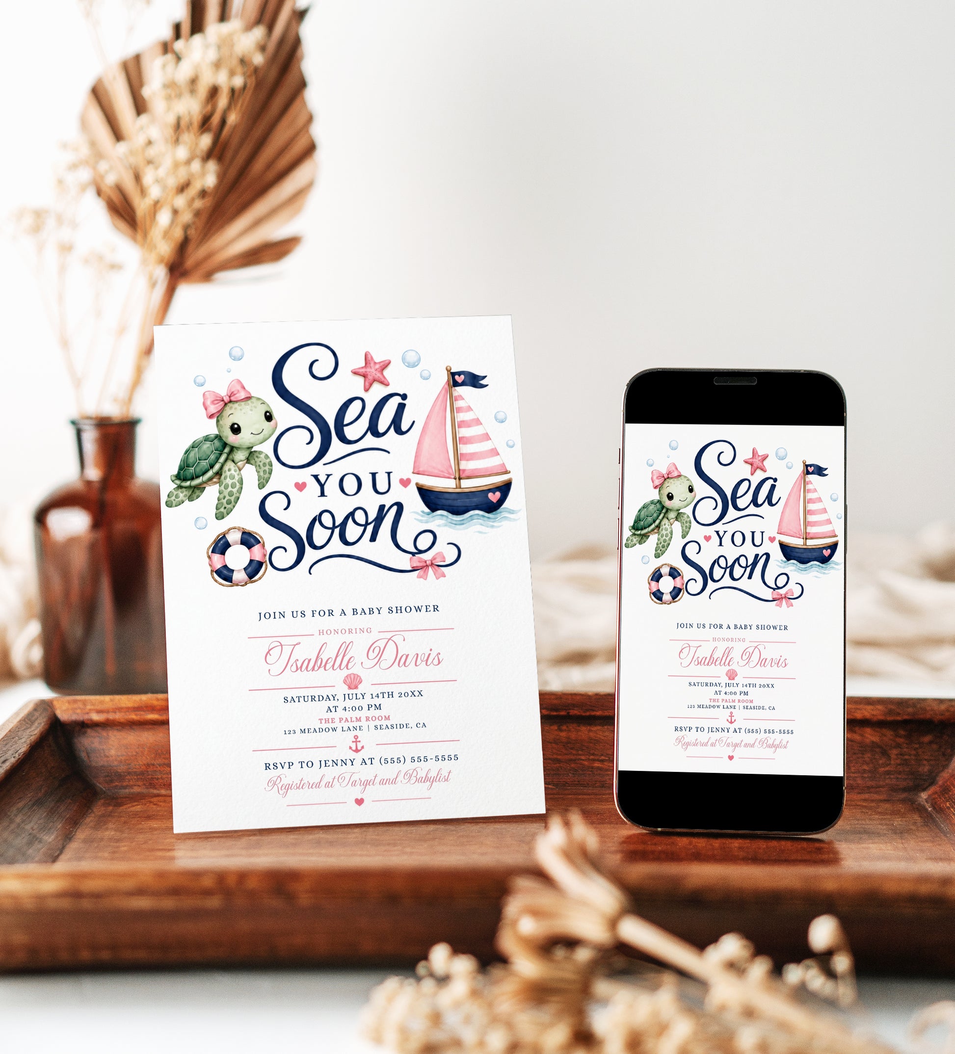 Editable pink nautical girl baby shower invitation Canva template with watercolour sea turtle with pink bow, pink striped sailboat, navy and pink life ring, starfish, and bold navy script with pink calligraphy on a white background