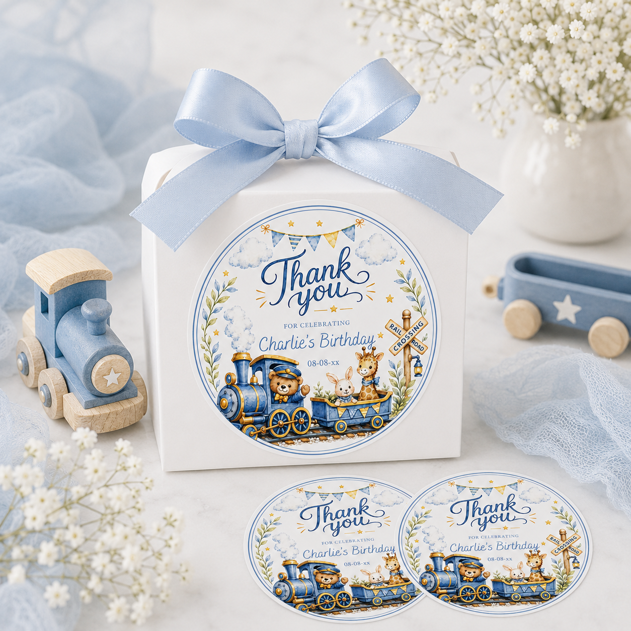 Round train birthday thank you sticker with a teddy bear conductor, giraffe, and bunny in soft blue and gold