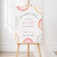 Editable donuts and sprinkles baby shower welcome sign Canva template with watercolour pastel donuts, rainbow sprinkles, and script typography on a soft white background
