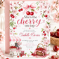 Cherry baby shower invitation featuring red cherries, pink cherry blossoms, blush gingham bows, cherry cart, basket and floral details.
