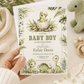 Baby boy dinosaur baby shower invitation with watercolor baby dinosaurs, hatching egg, tropical leaves, ferns, greenery, rocks, and soft sage green details