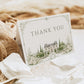 Elegant European style wedding folded thank you card template with watercolor stone building, white roses, cypress trees and sage green ornate border, editable in Canva