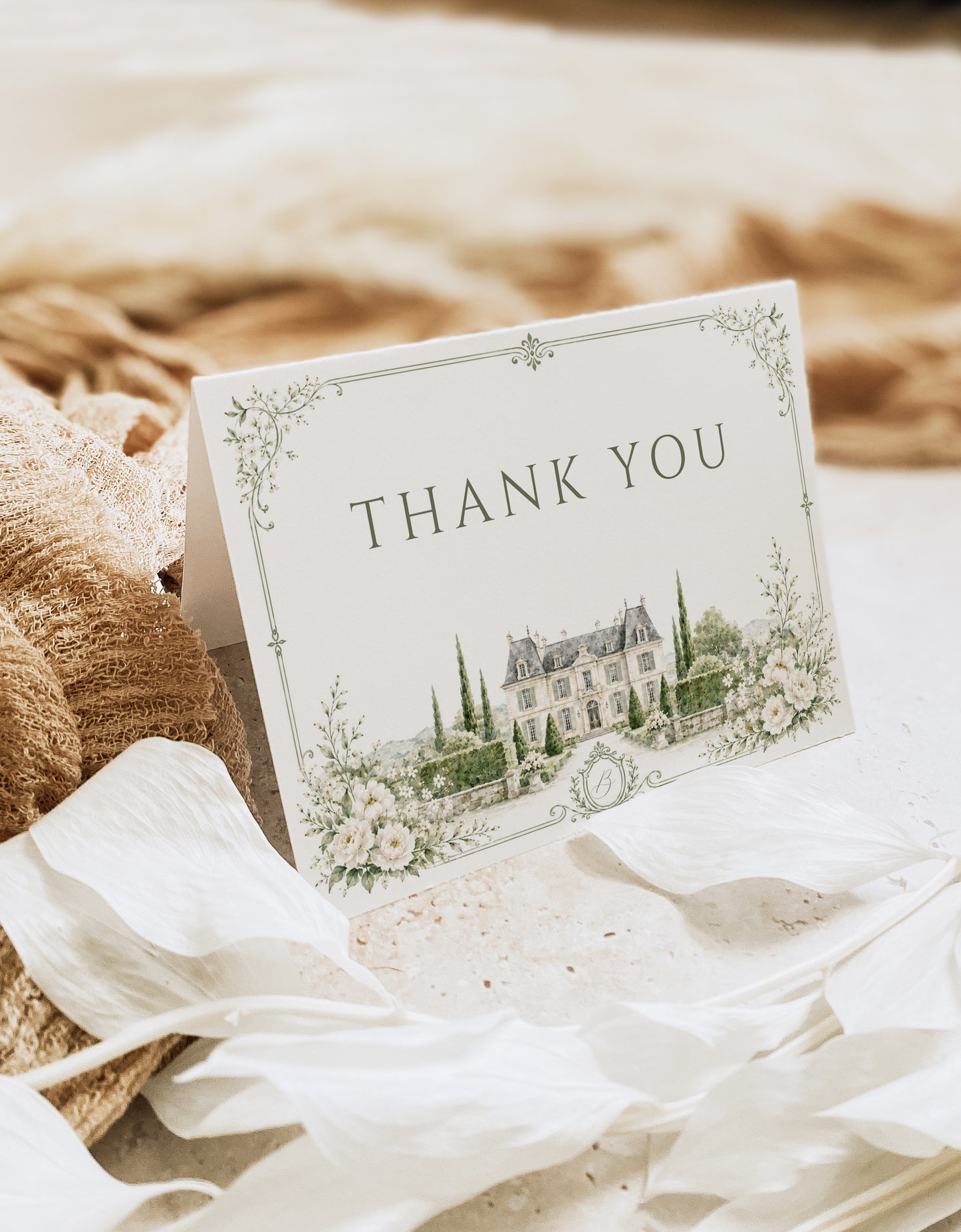 Elegant European style wedding folded thank you card template with watercolor stone building, white roses, cypress trees and sage green ornate border, editable in Canva