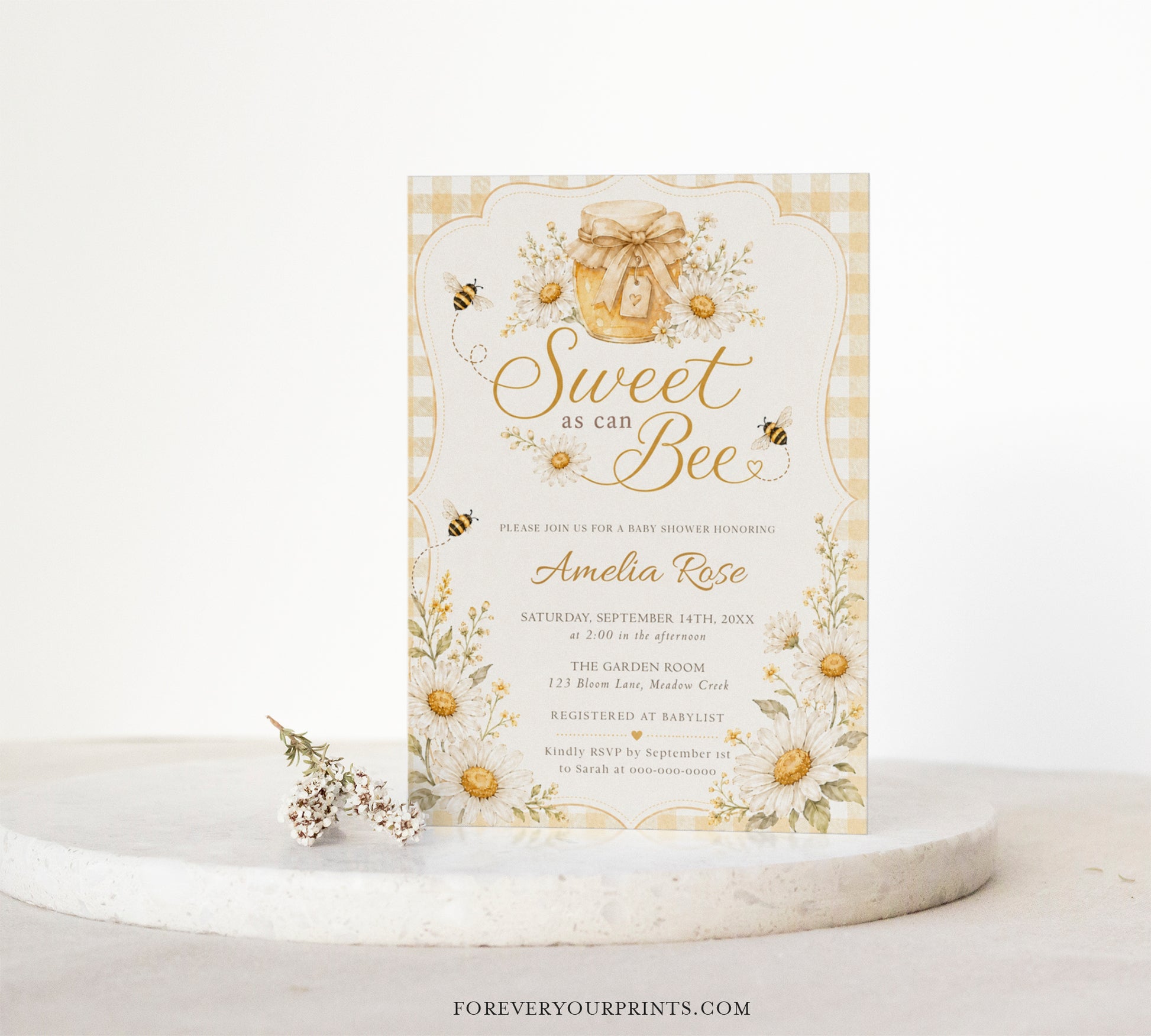 Editable sweet as can bee baby shower invitation Canva template with watercolour honey jar, white daisies, bumble bees, and gold script typography on a butter yellow gingham background