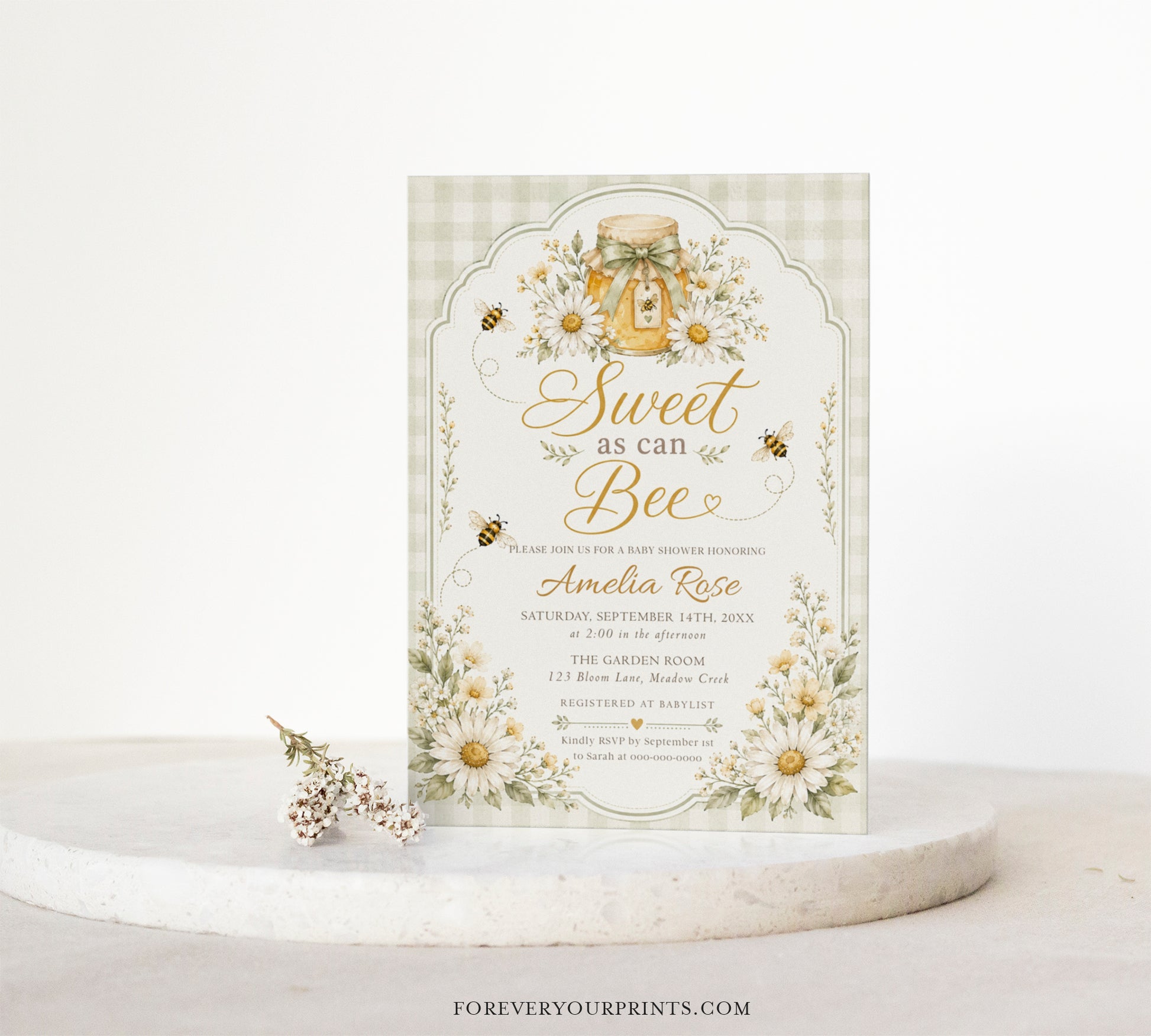 Editable sage green sweet as can bee baby shower invitation Canva template with watercolour honey jar, white daisies, bumble bees, and gold script typography on a sage gingham background