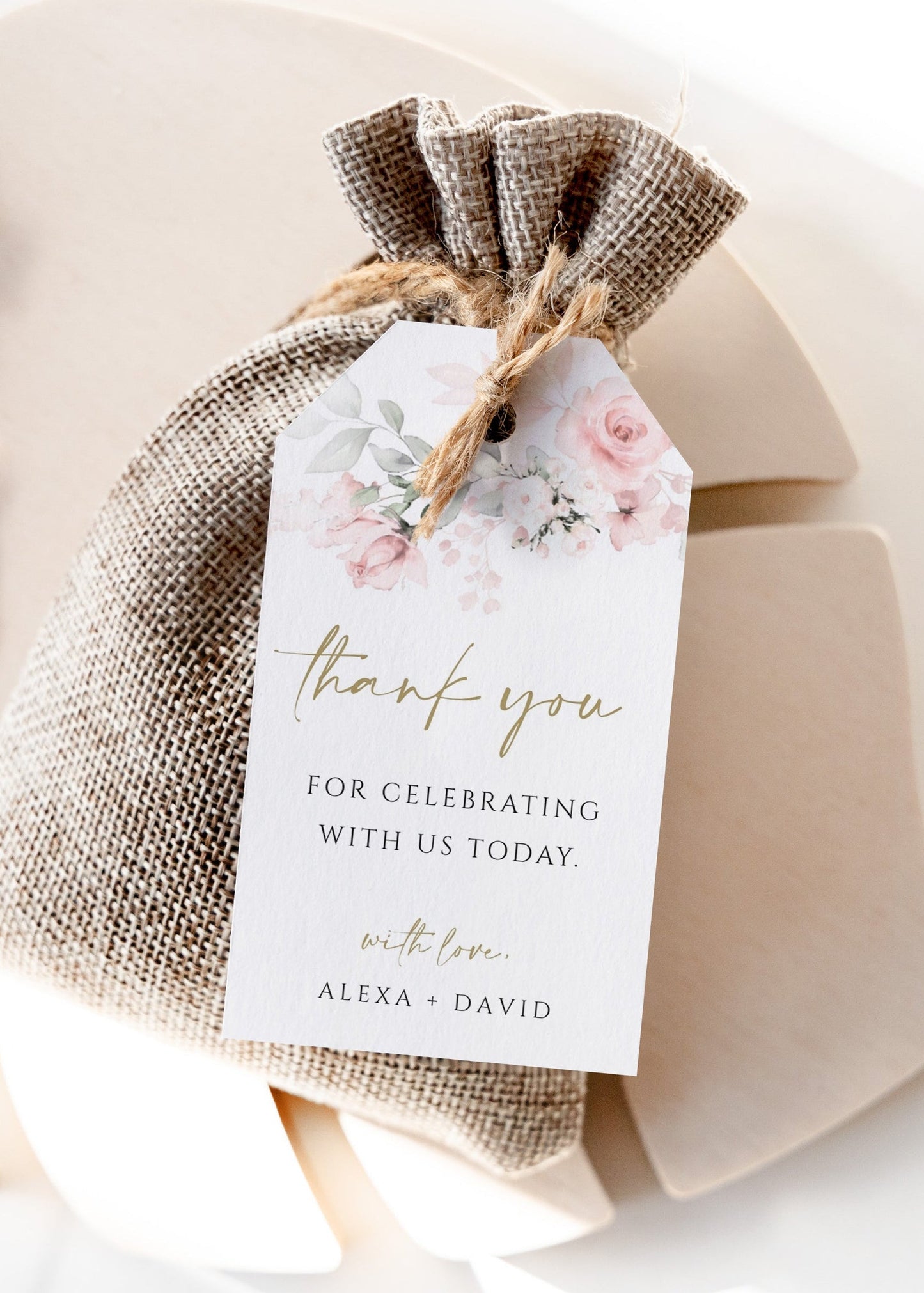 Blush pink floral wedding thank you gift tag template with watercolor roses, sage greenery, and gold script typography, editable in Canva