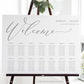 Minimalist gray horizontal wedding seating chart template with oversized calligraphy welcome script and 14 table layout, editable in Canva