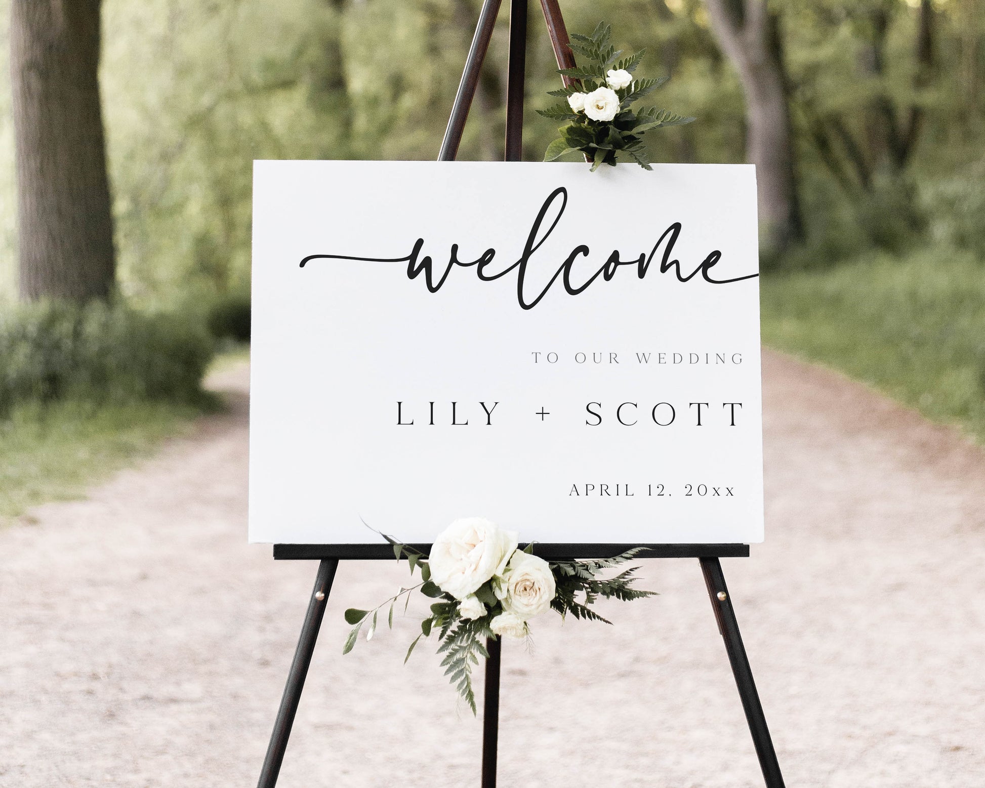 Minimalist black and white horizontal wedding welcome sign template with bold calligraphy script and spaced typography, editable in Canva