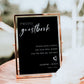 Black minimalist photo guestbook sign with elegant script and serif font, editable for wedding decor | www.foreveryourprints.com