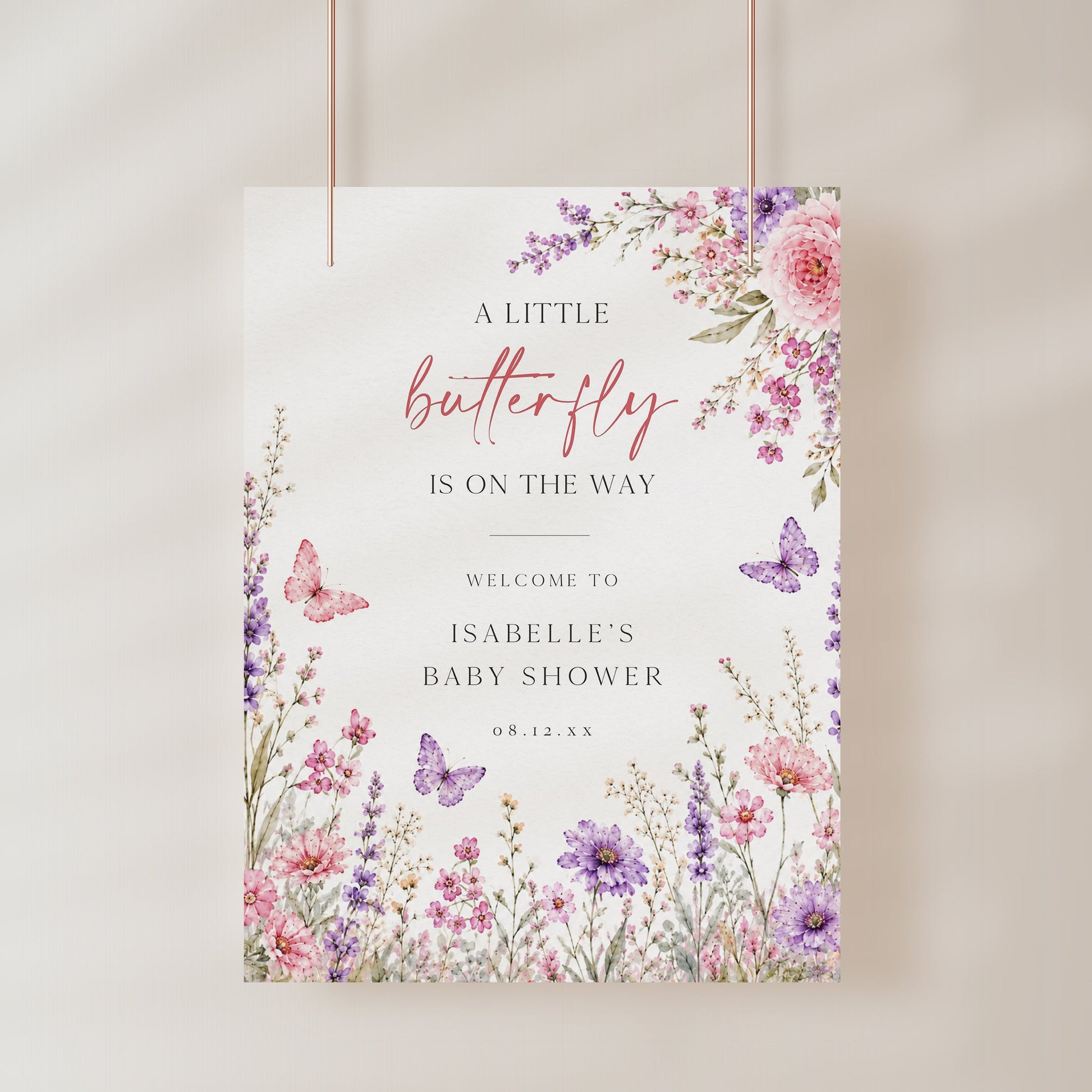 Editable butterfly baby shower welcome sign Canva template with watercolour pink and purple butterflies, peonies, lavender, and wildflower meadow on a white background, shown as a hanging print mockup