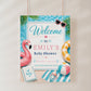 Pool party baby shower welcome sign with a flamingo float, beach ball, and heart sunglasses in pink and aqua