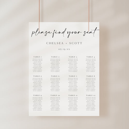 Modern black and white wedding seating chart sign template with oversized calligraphy script and 12 table layout, editable in Canva