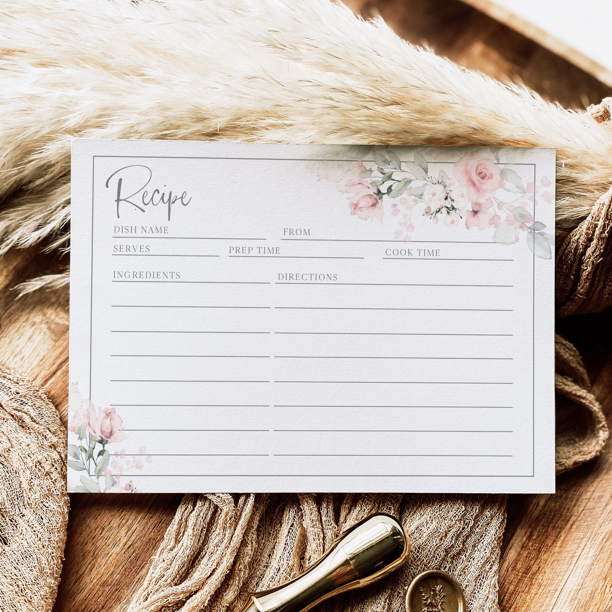 Blush pink floral recipe card template with watercolor roses and sage greenery in corner frames, editable in Canva