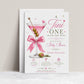 Editable martini baby shower invitation Canva template with pink martini glass, satin bow, heart-topped olive garnish, sparkle accents, and playful pink and olive green typography on a white background