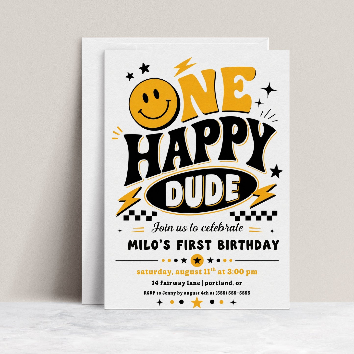One Happy Dude first birthday invitation with retro smiley face, yellow and black lettering, lightning bolts, stars, and checkerboard birthday party details
