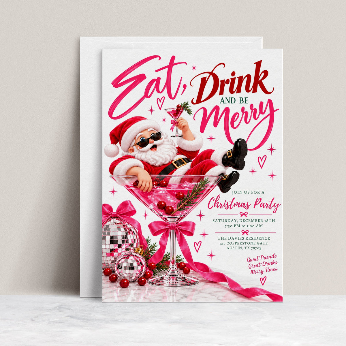 Christmas cocktail party invitation with Santa wearing sunglasses in a giant pink martini glass, disco ball ornaments, pink bows, and Eat Drink and Be Merry lettering