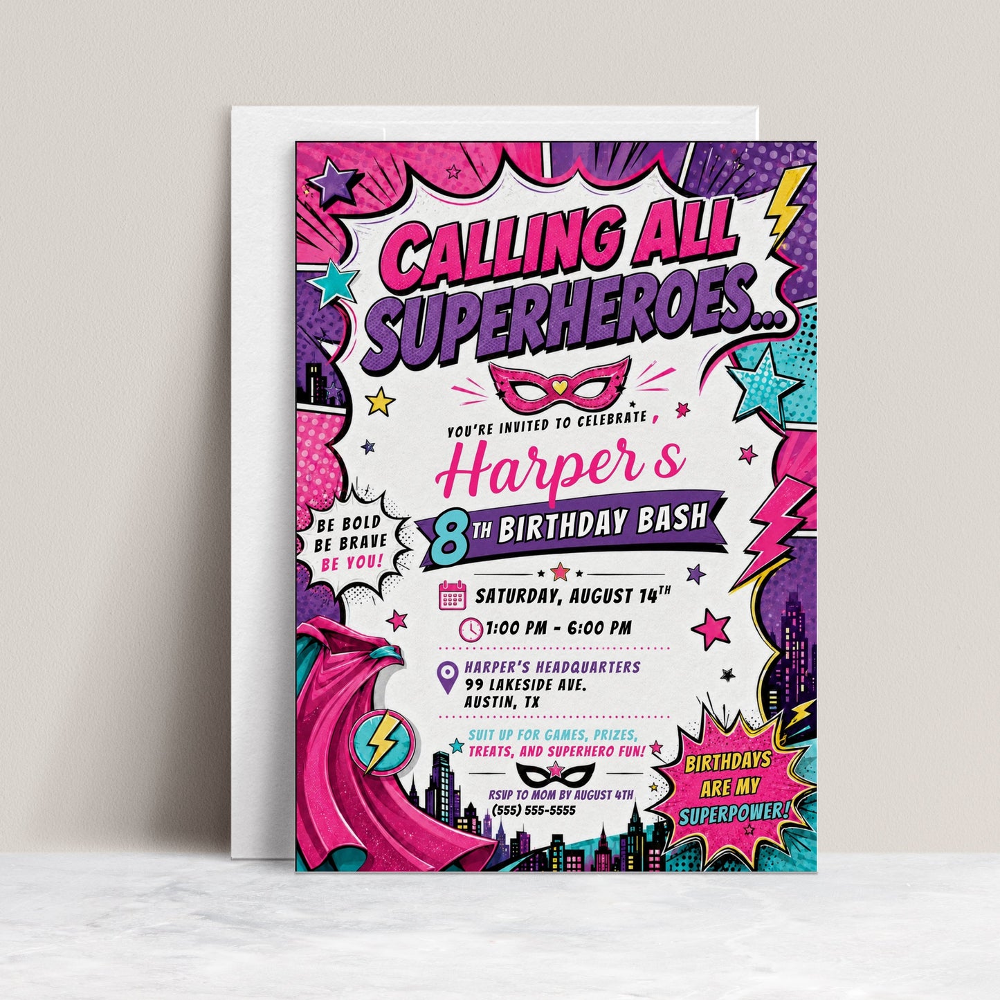 Girls superhero birthday invitation featuring a pink comic book design with cape, mask, city skyline, stars, lightning bolts and bold action graphics.
