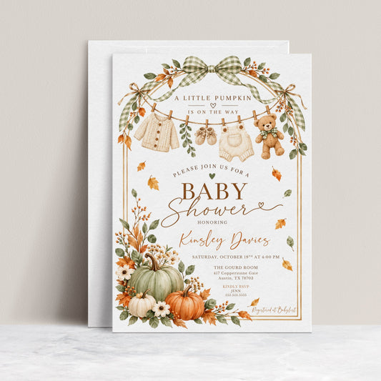 Little Pumpkin baby shower invitation with sage green and orange pumpkins, gingham bows, fall leaves, teddy bear, and knitted baby clothes on a clothesline