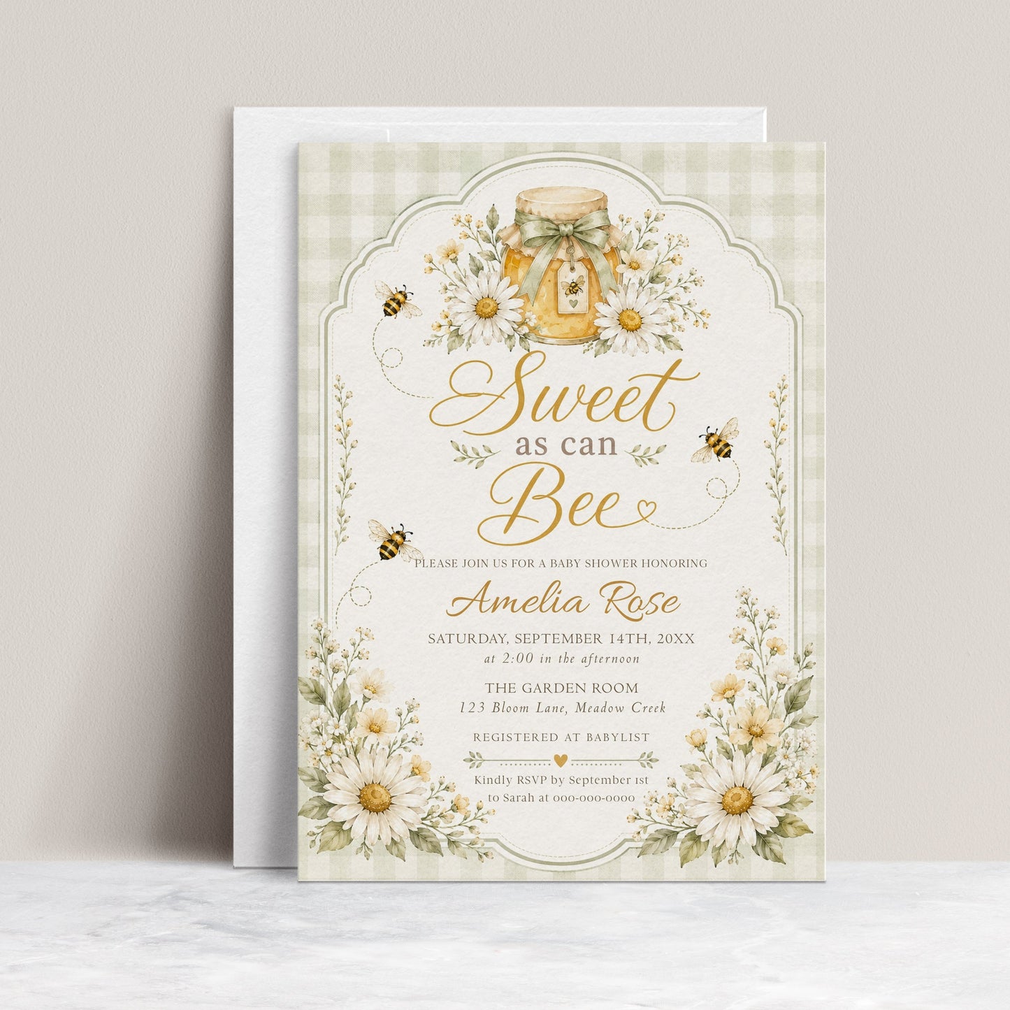 Editable sage green sweet as can bee baby shower invitation Canva template with watercolour honey jar, white daisies, bumble bees, and gold script typography on a sage gingham background
