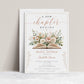 A New Chapter bridal shower invitation featuring an open book surrounded by blush pink and terracotta florals with green foliage.
