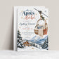 Après Bébé baby shower invitation with a basket-style ski lift holding a plush bunny and knit blanket above snowy mountains, evergreen trees, and a ski chalet