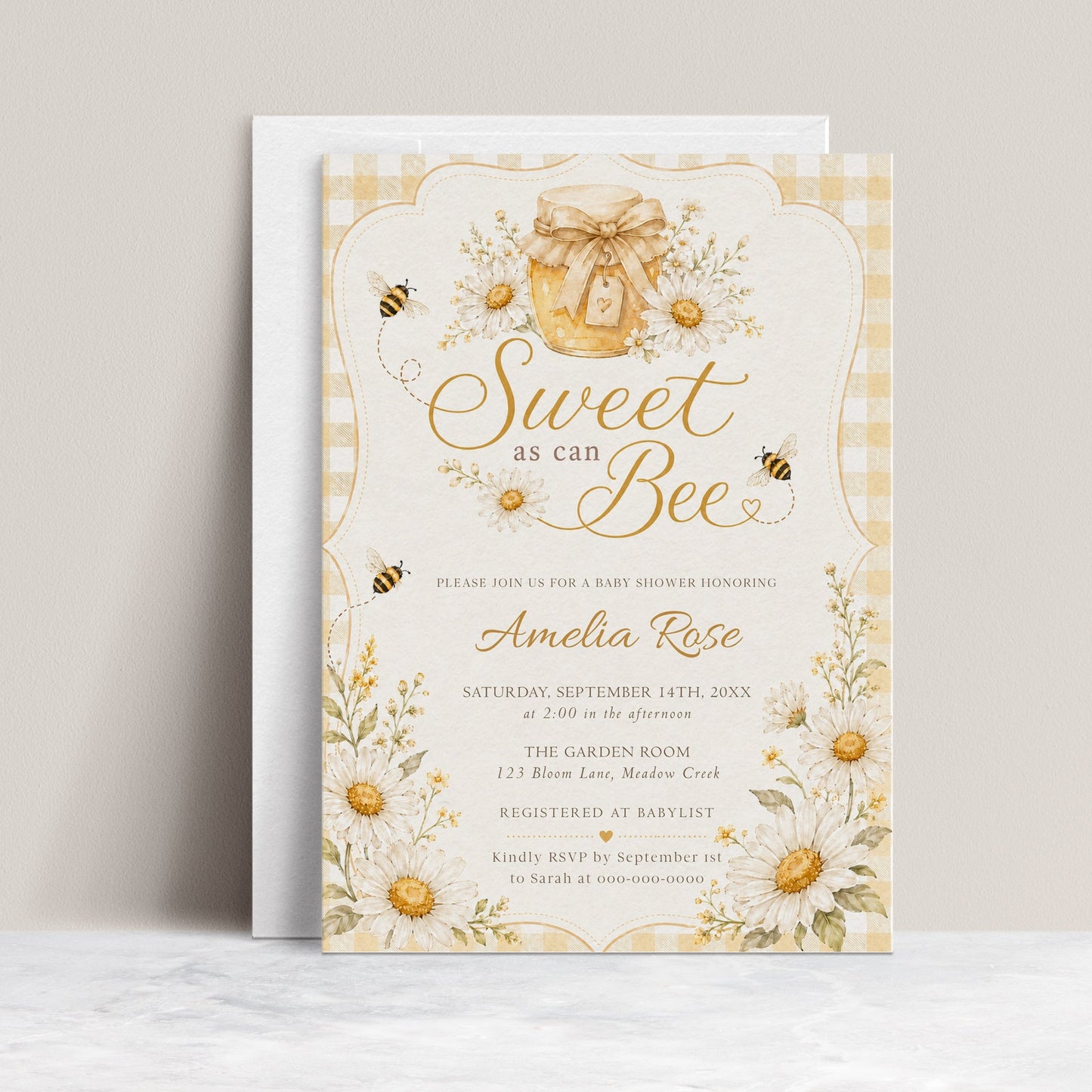 Editable sweet as can bee baby shower invitation Canva template with watercolour honey jar, white daisies, bumble bees, and gold script typography on a butter yellow gingham background
