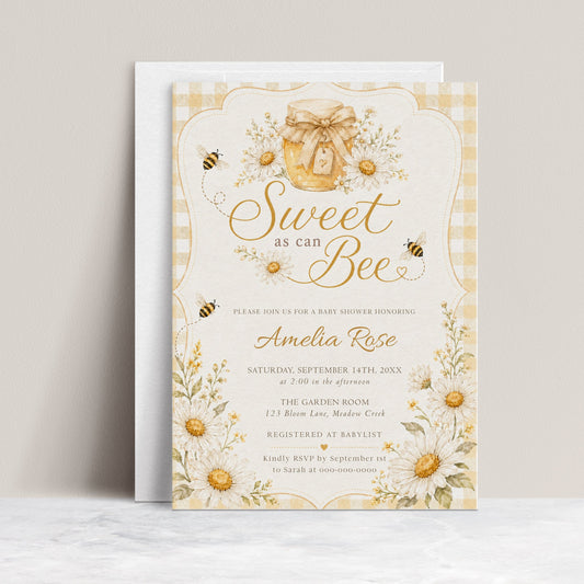 Editable sweet as can bee baby shower invitation Canva template with watercolour honey jar, white daisies, bumble bees, and gold script typography on a butter yellow gingham background